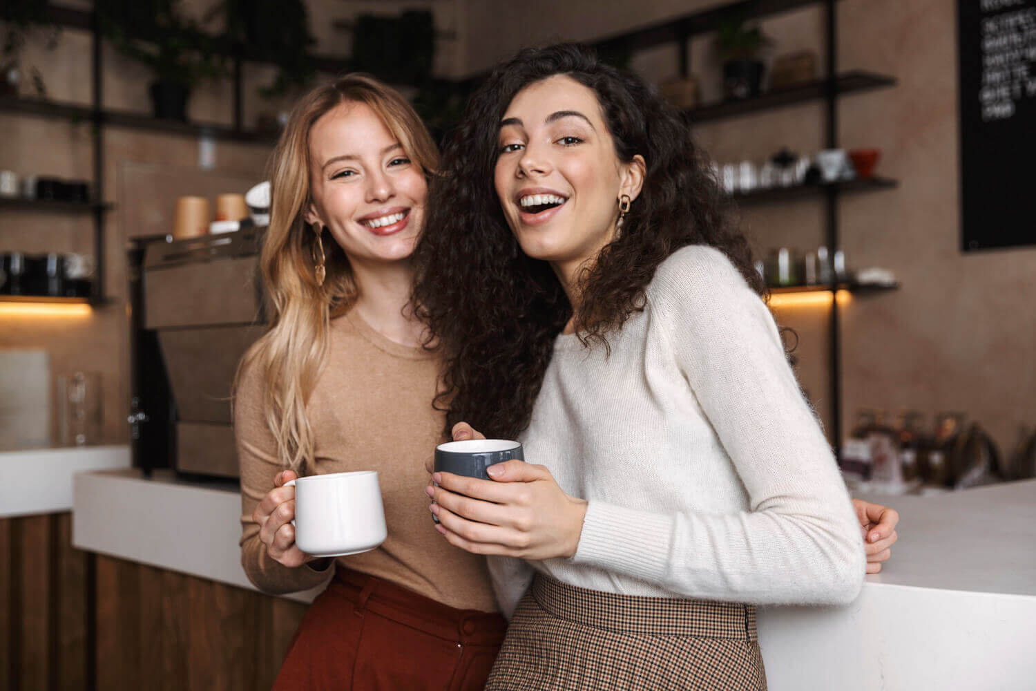 two women enjoying a cup of coffee